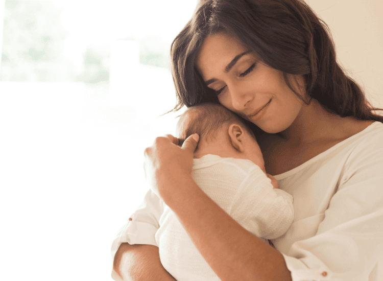 Mother holding newborn baby